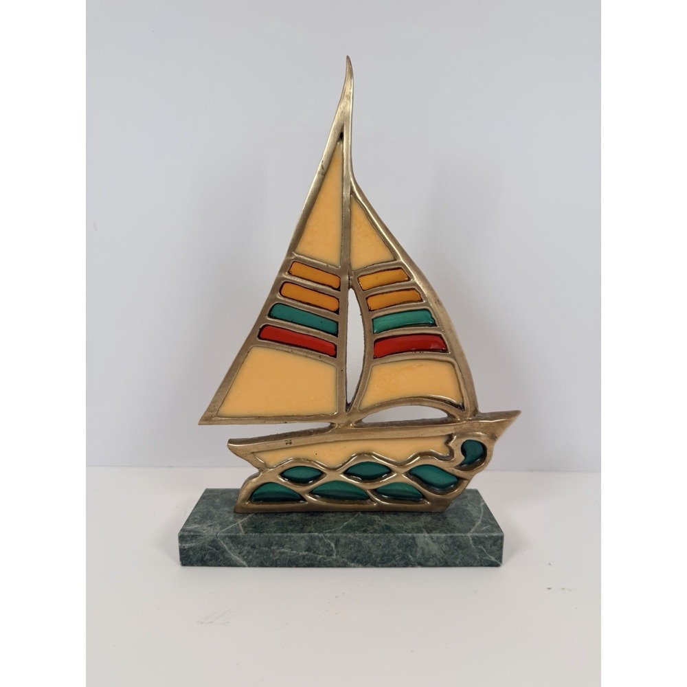 Vintage brass and stained glass sailboat sculpture with a granite base. Enesco